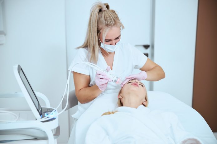 person making cosmetological operation