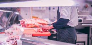 Important Points in the Meat Export Trade person slicing the meat in the shop