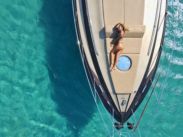 person laying on yacht