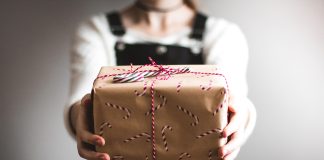 5 Reasons Why Presenting Boxes with Chocolates is a Good Idea person holding the present