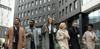 Winter Formalwear: An Easy Suit Shopping Guide for Bigger Men Coworkers Taking a Coffee Break and Walking