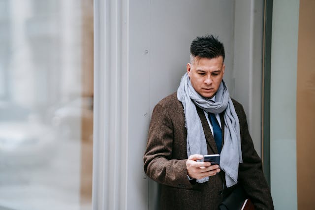 photo-of-man-using-smartphone