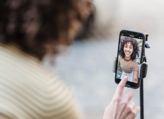 How Can Coverstar App Turn an Ordinary Video into a Social Media Hit? crop-smiling-ethnic-blogger-recording-video-on-smartphone