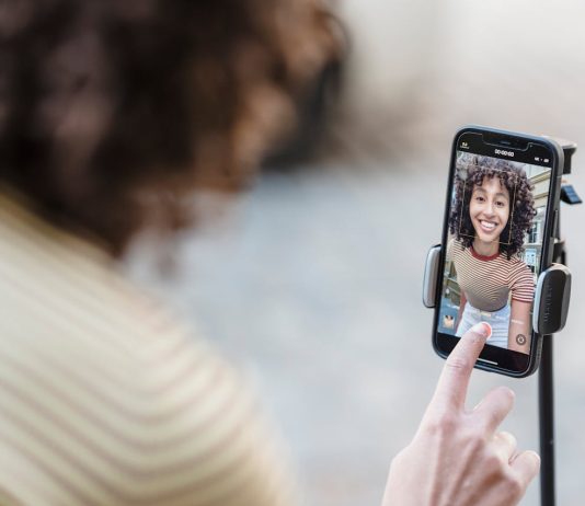 How Can Coverstar App Turn an Ordinary Video into a Social Media Hit? crop-smiling-ethnic-blogger-recording-video-on-smartphone